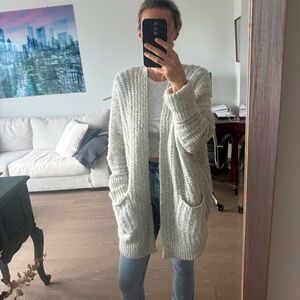 Light gray long knit sweater.